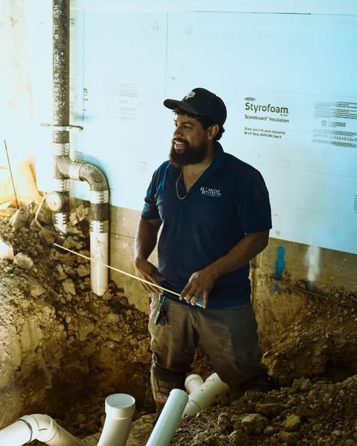 Haltex Plumbing technician at an excavation site for sewer line repair